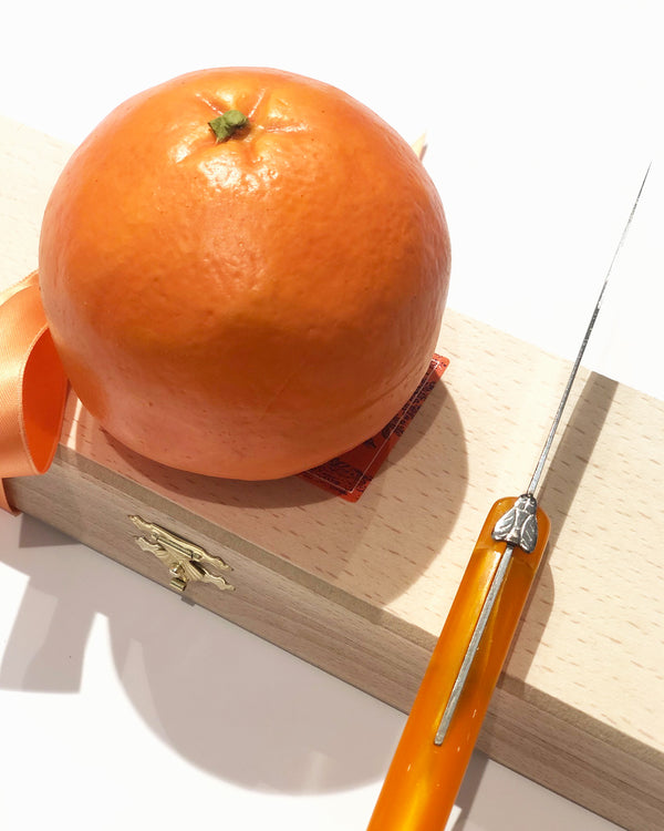 Orange knife, beech wood box